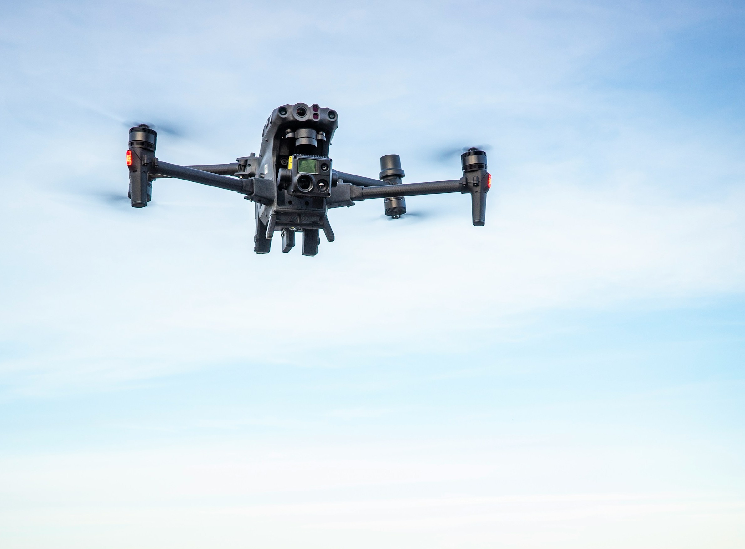 Close-up drone inspection of a tiled residential roof and balcony