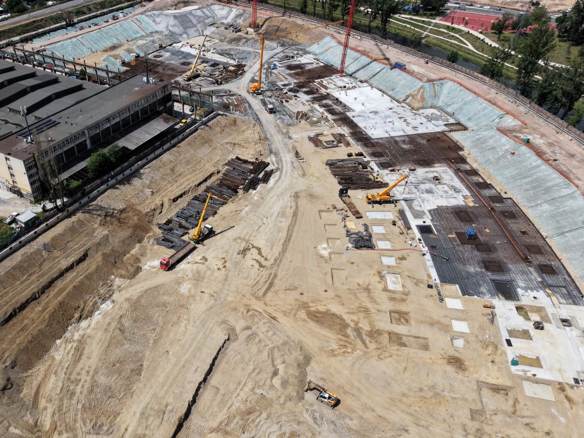 Drone hovering above a construction landscape